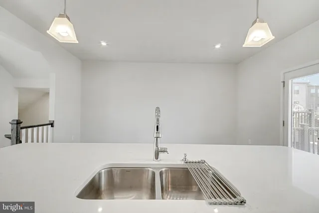 a kitchen that has a sink and a stove