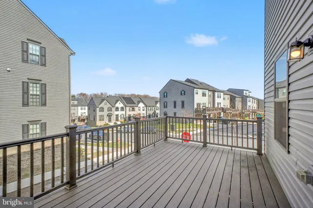 a view of a balcony with wooden floor