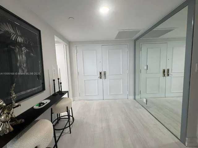 a view of room with walk in closet and window