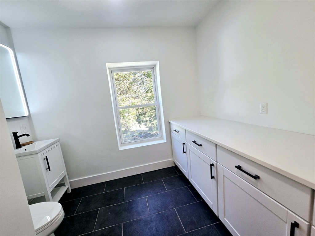 321 Riverside Drive Northampton, MA 01062 - Photo 12 of 24 a bathroom with a toilet sink and mirror