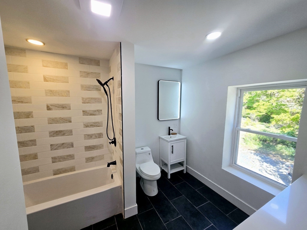 321 Riverside Drive Northampton, MA 01062 - Photo 13 of 24 a bathroom with a bathtub sink and toilet