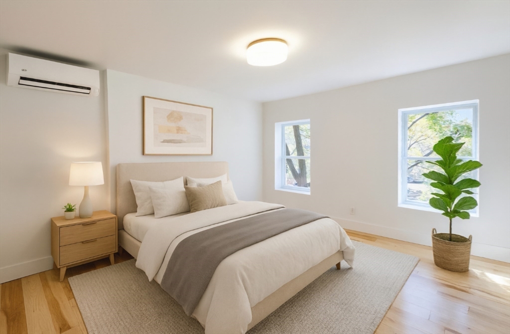 321 Riverside Drive Northampton, MA 01062 - Photo 16 of 24 a bedroom with bed and a potted plant