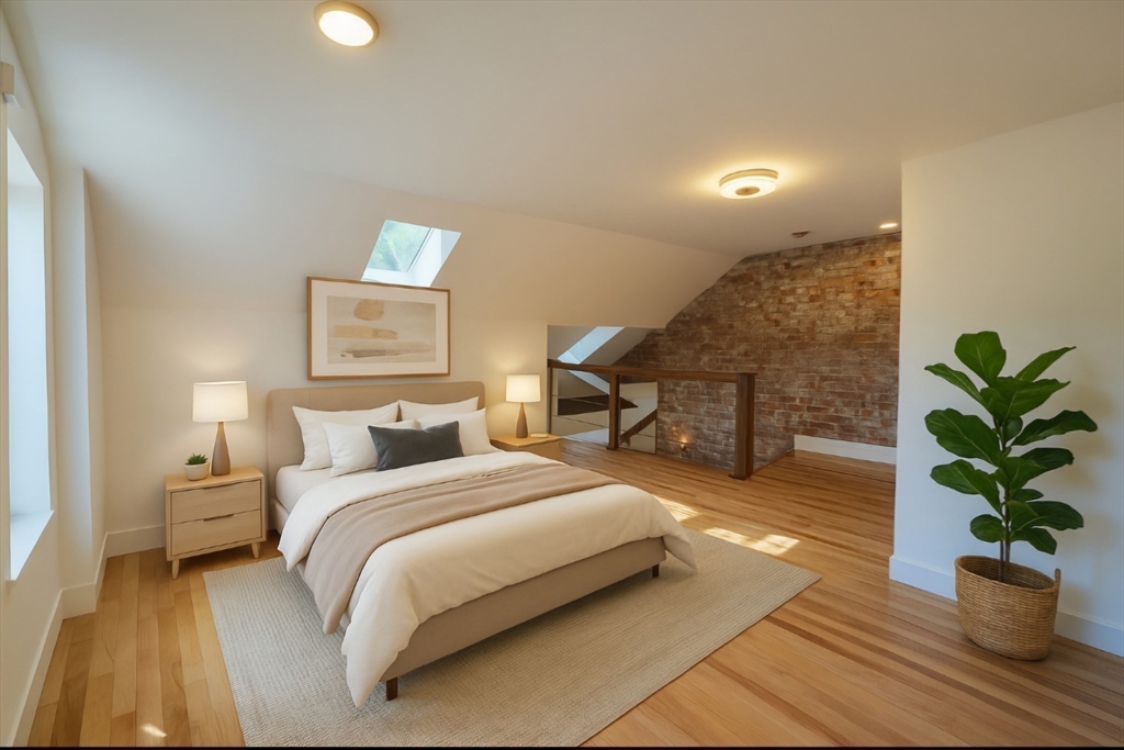 321 Riverside Drive Northampton, MA 01062 - Photo 23 of 24 a bedroom with a bed and a potted plant