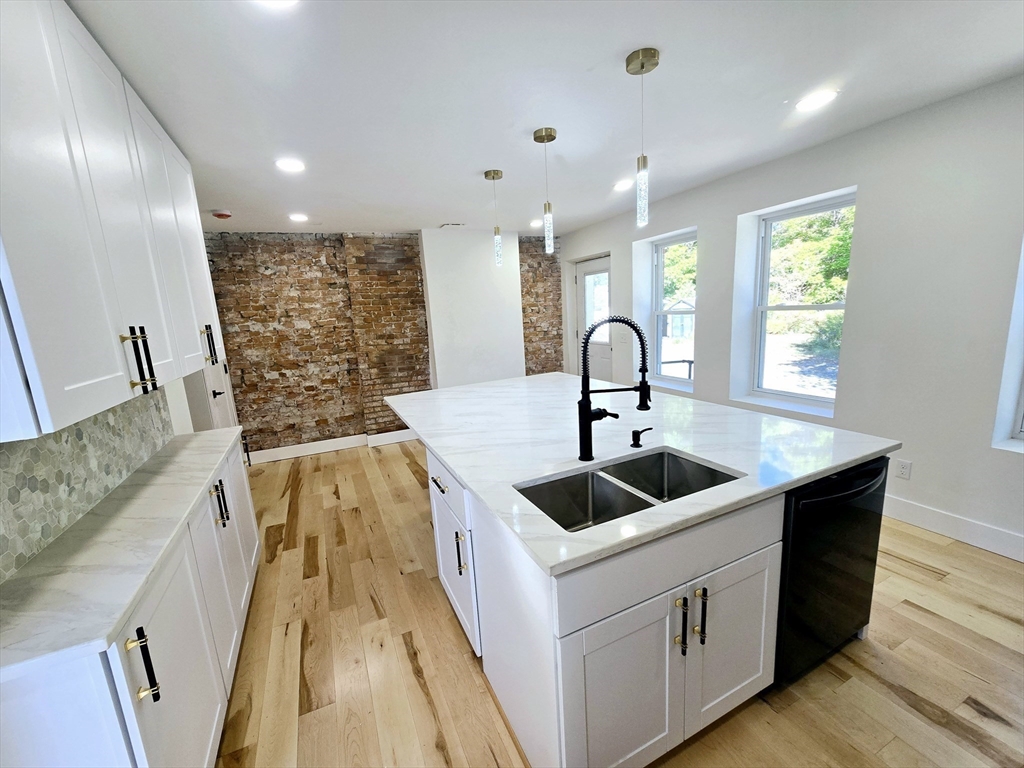 321 Riverside Drive Northampton, MA 01062 - Photo 3 of 24 a kitchen with a sink and a large window