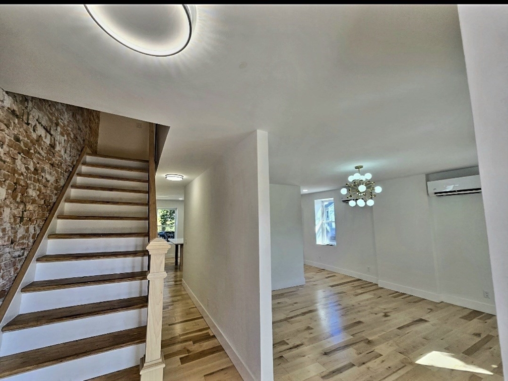 321 Riverside Drive Northampton, MA 01062 - Photo 8 of 24 a view of a livingroom with wooden floor and stairs