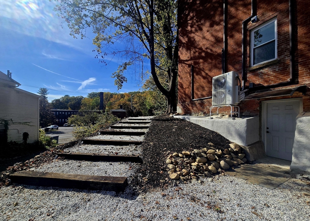 321 Riverside Drive Northampton, MA 01062 - Photo 10 of 24 a view of a yard with cars parked
