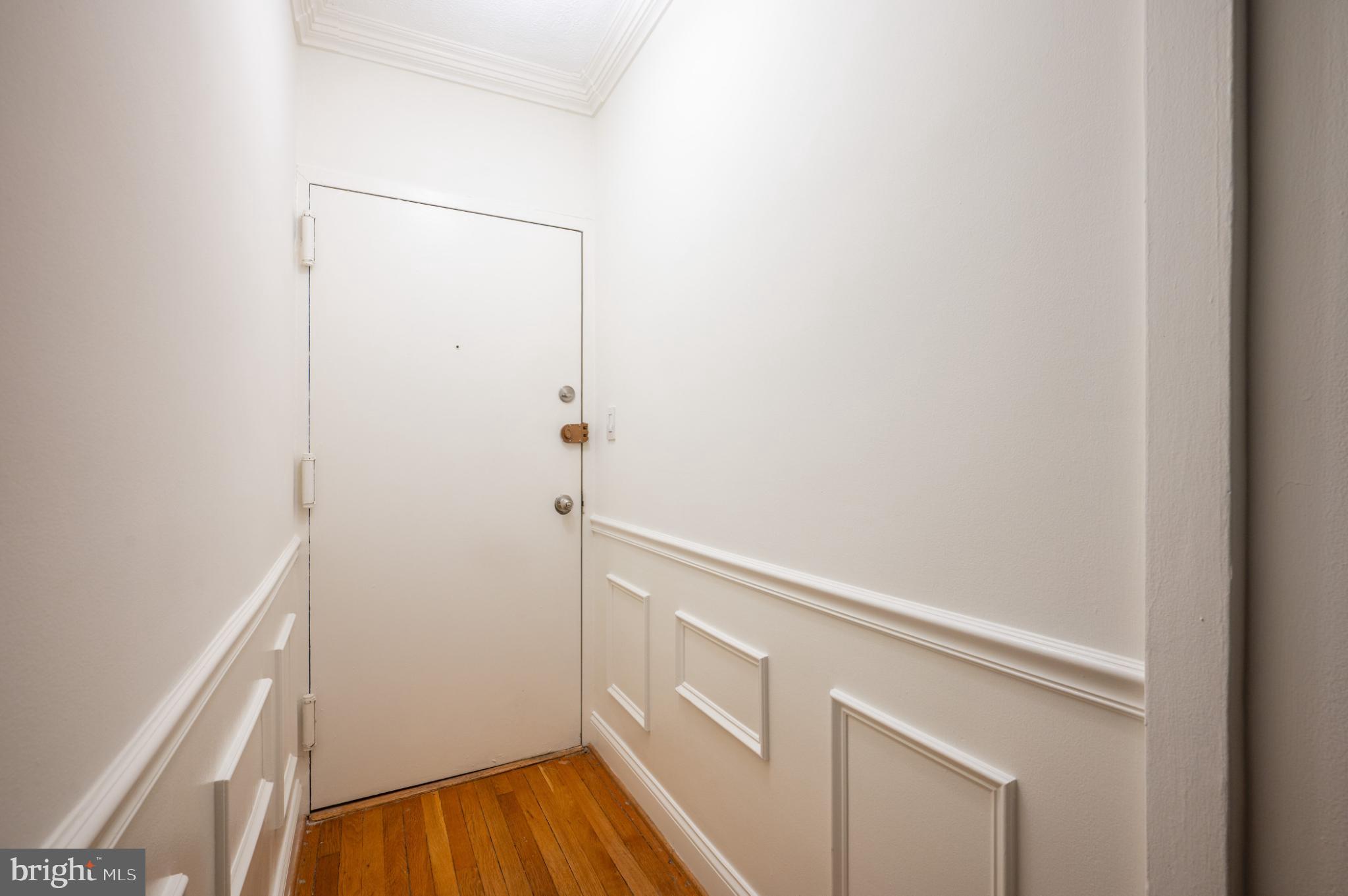 3719 12th Street Northeast, Unit 209 Washington, DC 20017 - Photo 3 of 24 Secure entry hall leading to living room.