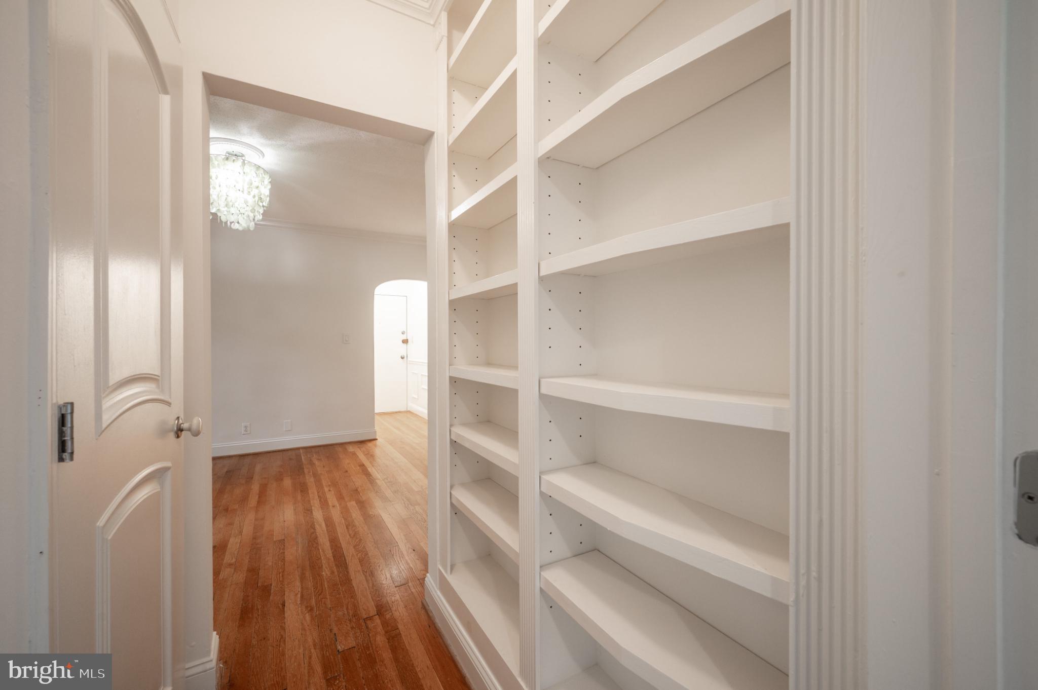 3719 12th Street Northeast, Unit 209 Washington, DC 20017 - Photo 10 of 24 Bedroom hallway with large built in shelving.