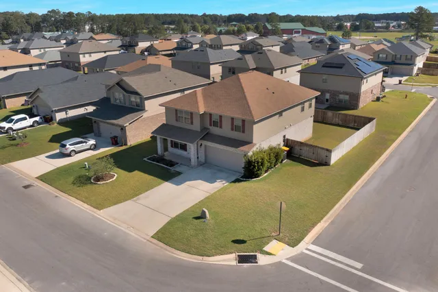 an aerial view of a house with a garden