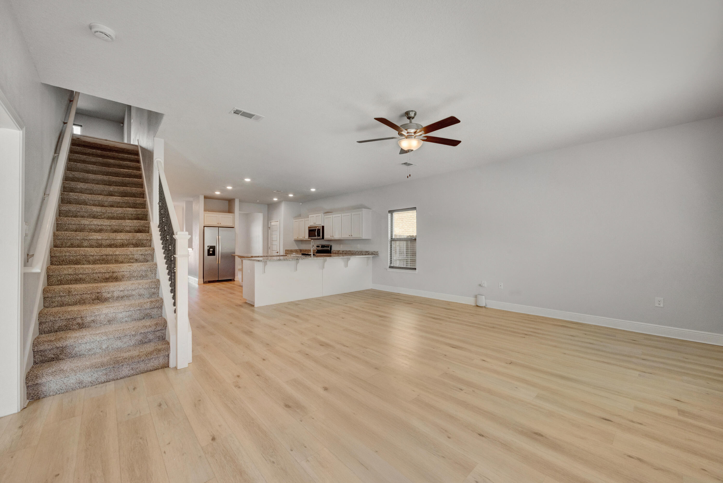 231 Baycliff Drive Crestview, FL 32536 - Photo 15 of 49 a view of a kitchen with furniture and wooden floor