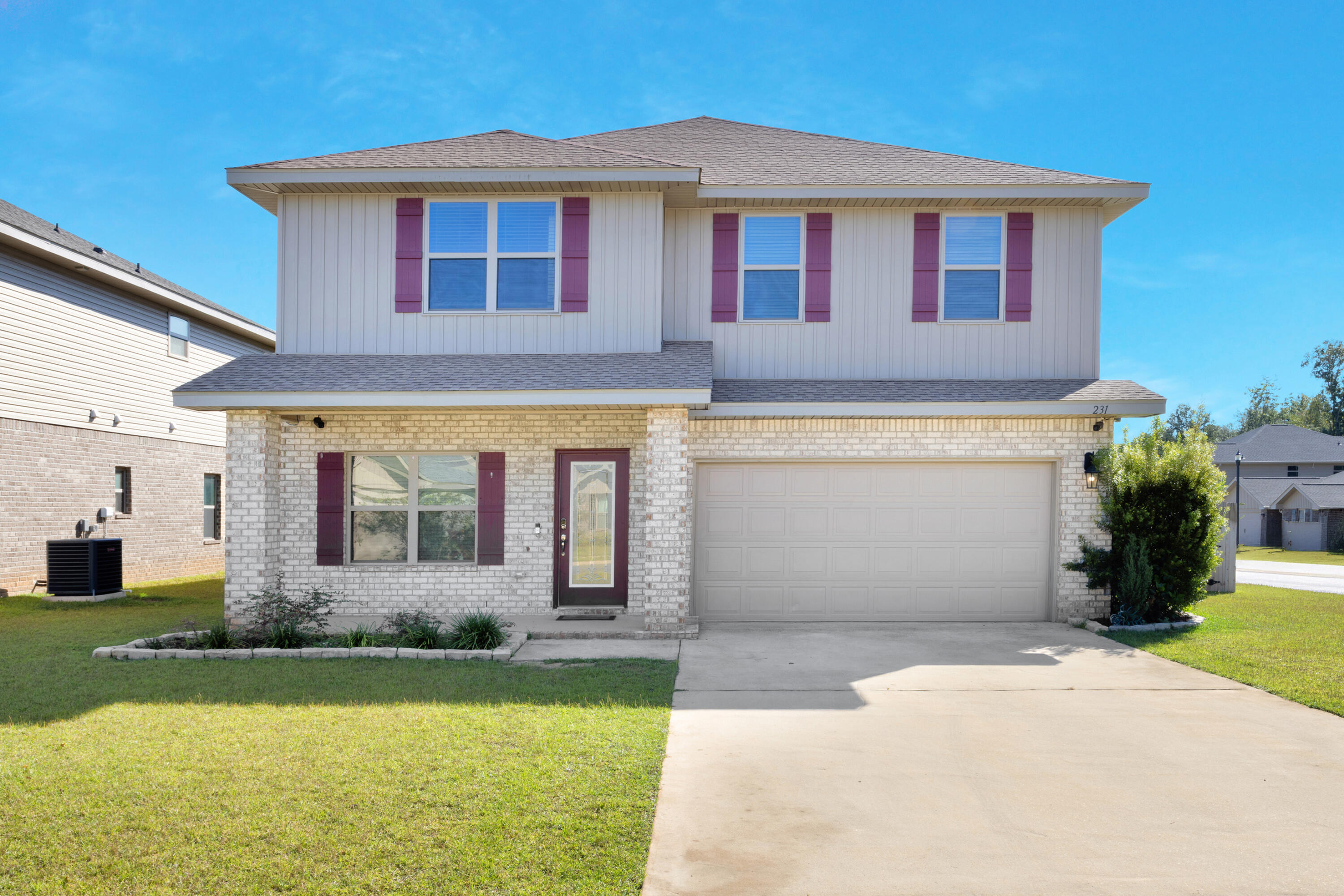 231 Baycliff Drive Crestview, FL 32536 - Photo 2 of 49 a front view of a house with garden