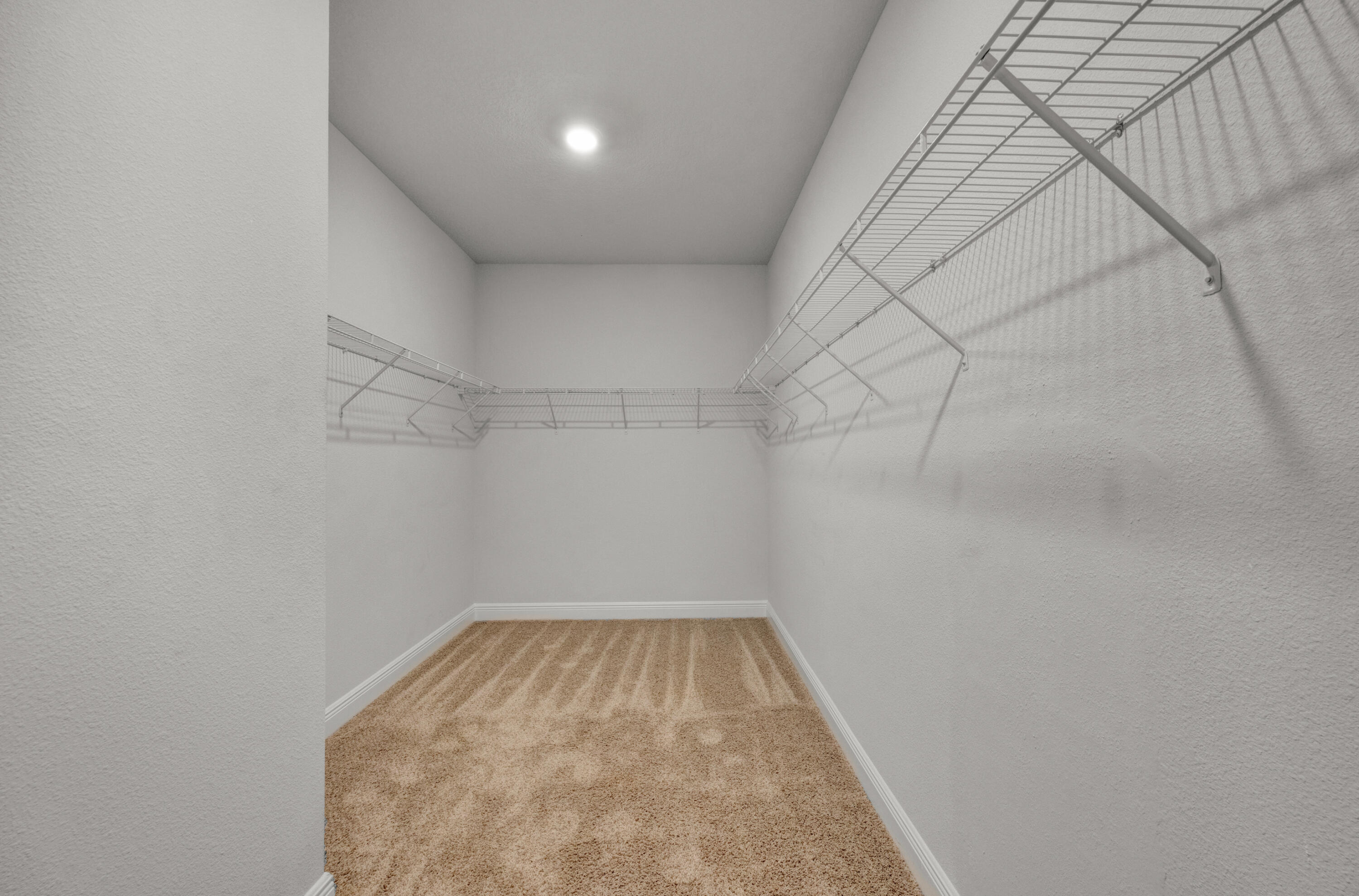 231 Baycliff Drive Crestview, FL 32536 - Photo 23 of 49 a view of a room with racks on the wall