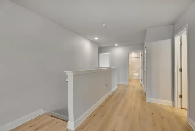 an aerial view of a house with a swimming pool