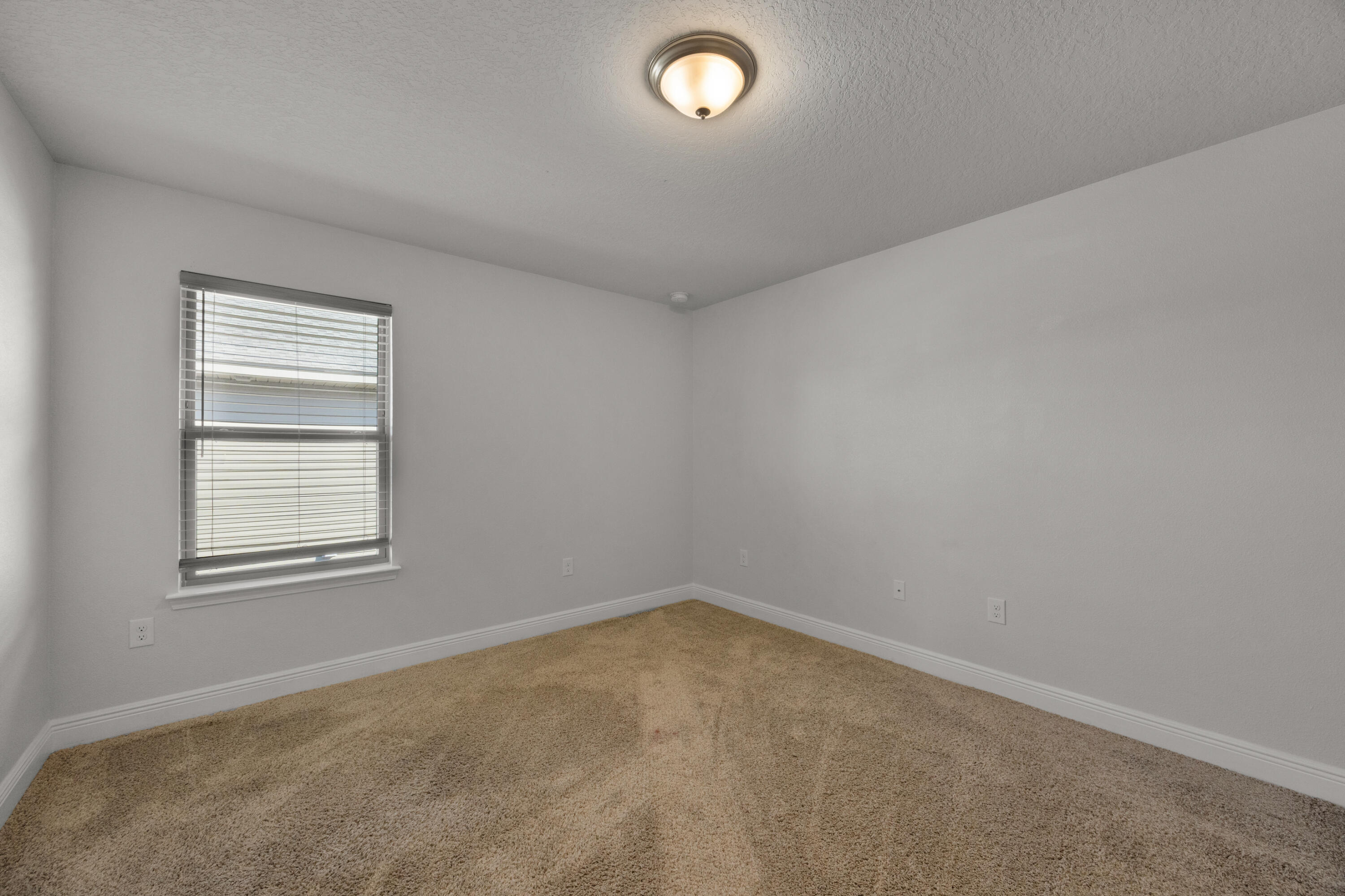 231 Baycliff Drive Crestview, FL 32536 - Photo 27 of 49 an empty room with a window