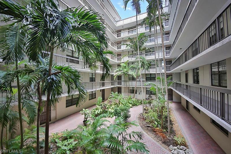 651 Seaview Court, Unit B207 Marco Island, FL 34145 - Photo 15 of 17 a view of balcony with potted plants and palm trees