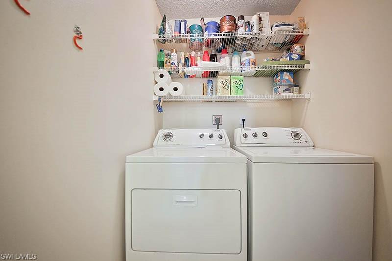 651 Seaview Court, Unit B207 Marco Island, FL 34145 - Photo 17 of 17 a utility room with dryer and washer