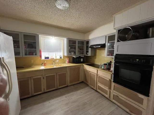 a kitchen with stainless steel appliances granite countertop a stove and a sink