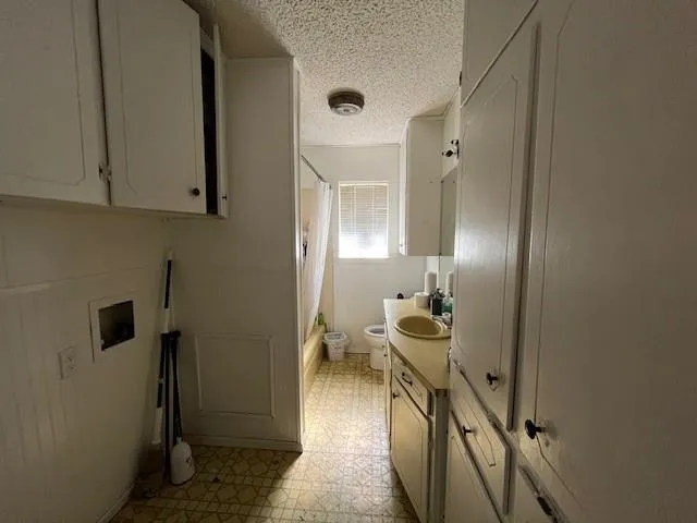 a view of a livingroom with furniture and front door