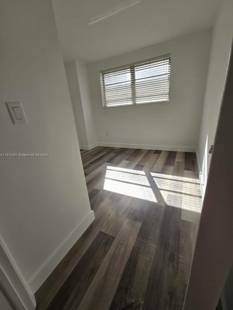 1673 Bay Road, Unit 301 Miami Beach, FL 33139 - Photo 11 of 18 a view of empty room with window