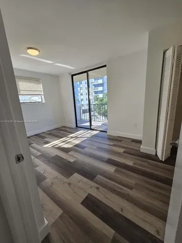 a spacious bathroom with a sink and a mirror