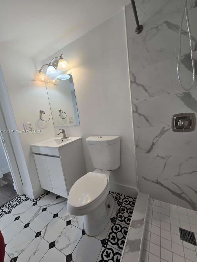1673 Bay Road, Unit 301 Miami Beach, FL 33139 - Photo 10 of 18 a bathroom with a toilet and a shower