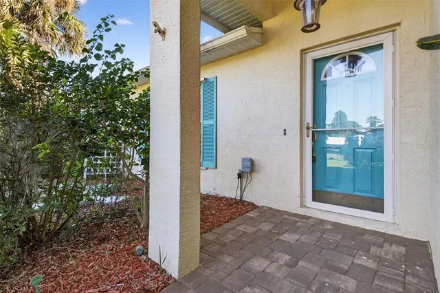 a view of a hallway with a outdoor space
