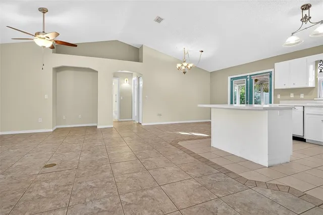 a kitchen with stainless steel appliances cabinets a sink and a stove