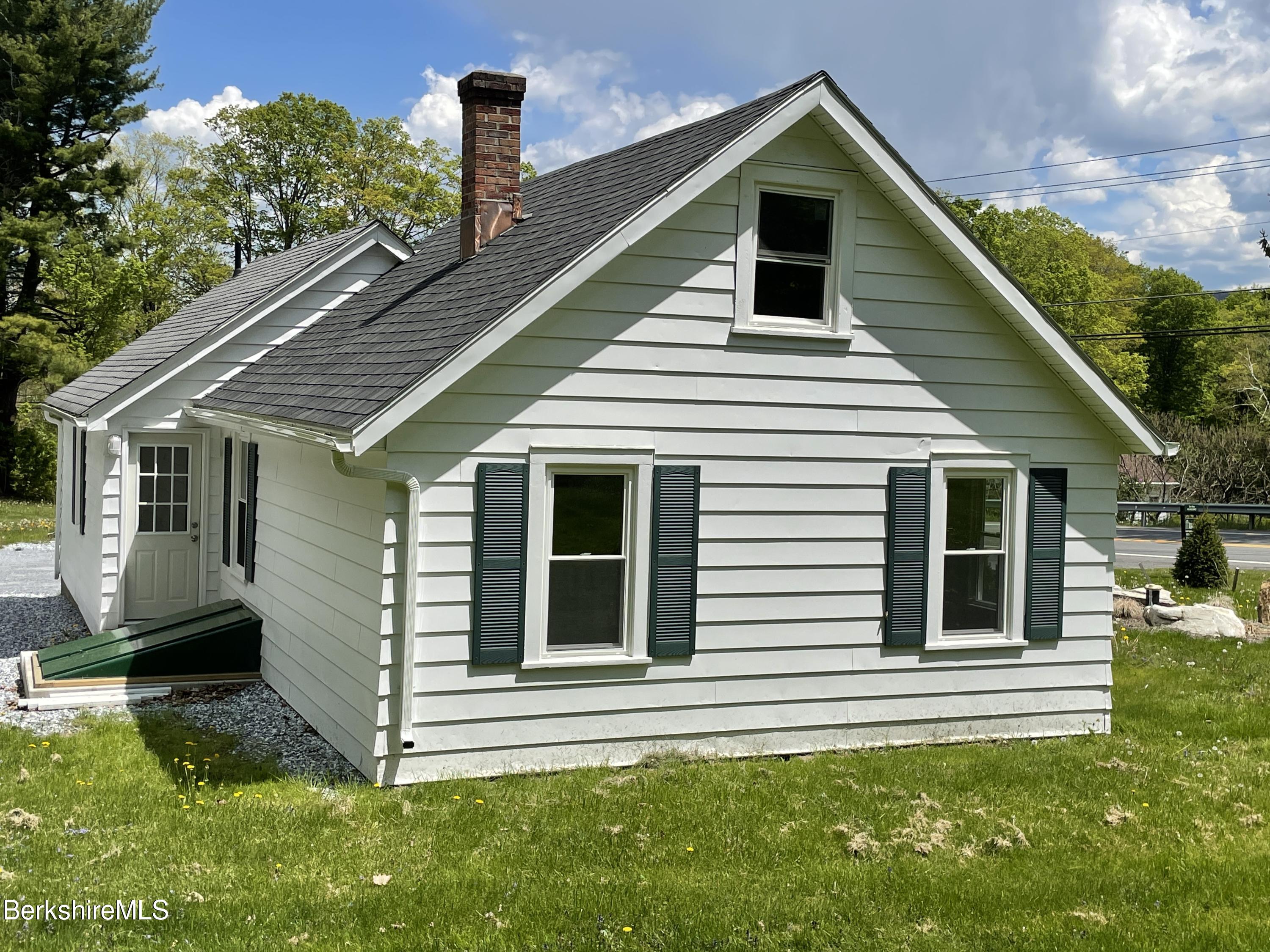 660 State Road Richmond, MA 01254 - Photo 11 of 15 a front view of a house with a yard