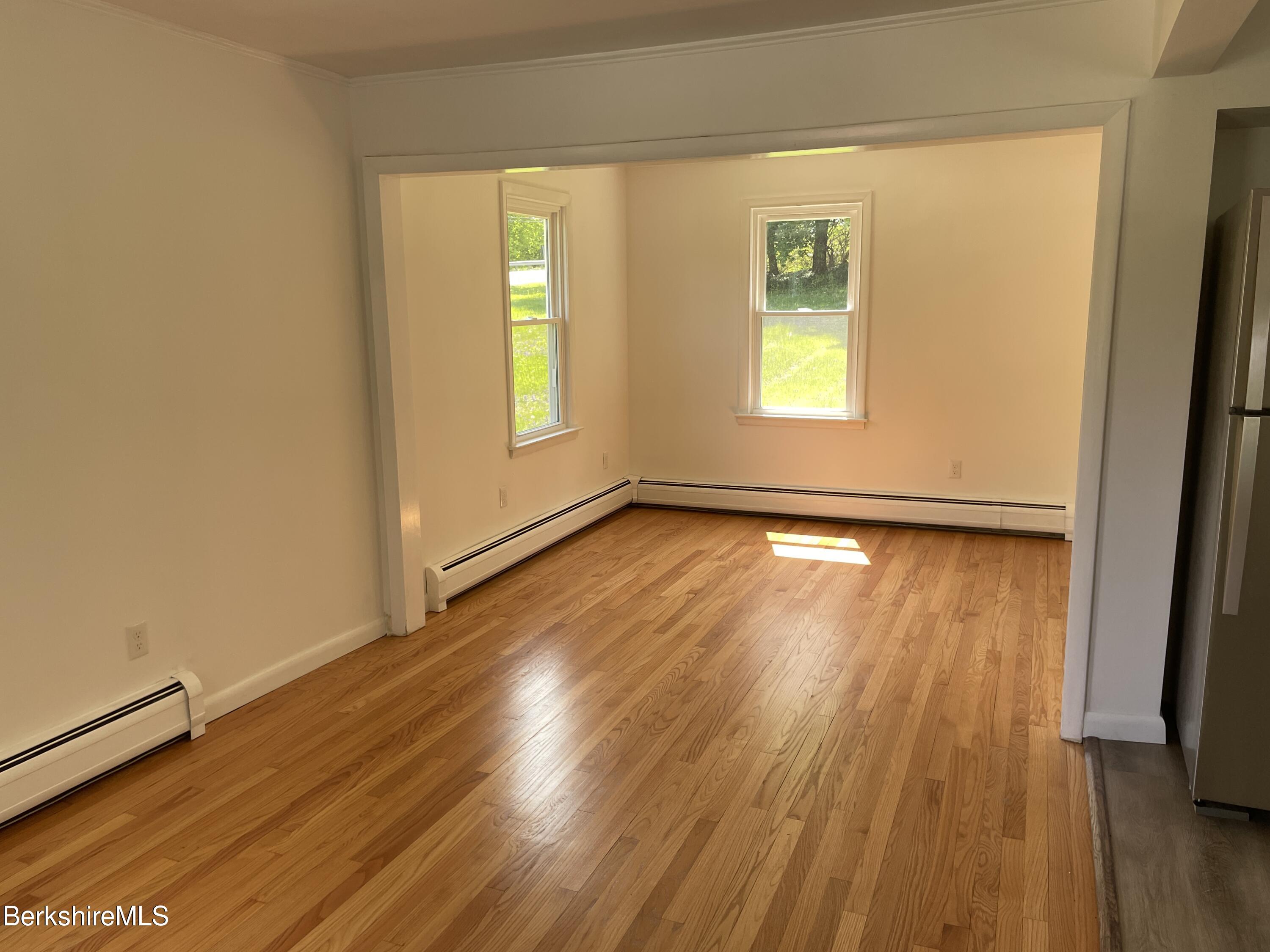 660 State Road Richmond, MA 01254 - Photo 4 of 15 a view of an empty room with wooden floor and a window