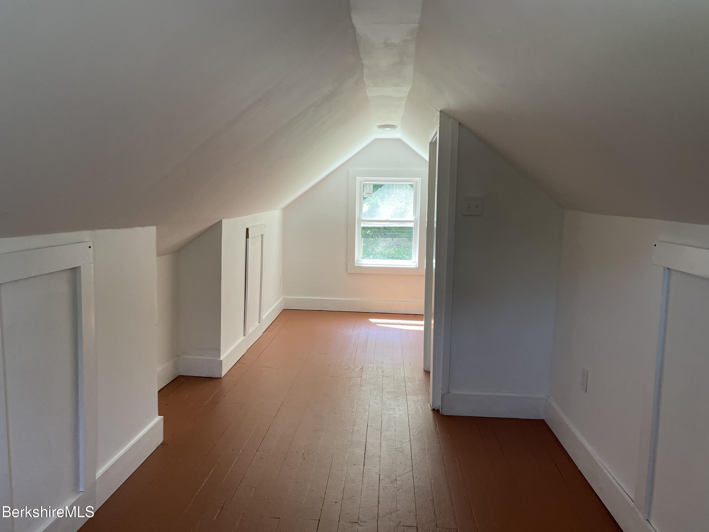 660 State Road Richmond, MA 01254 - Photo 10 of 15 an empty room with wooden floor and windows