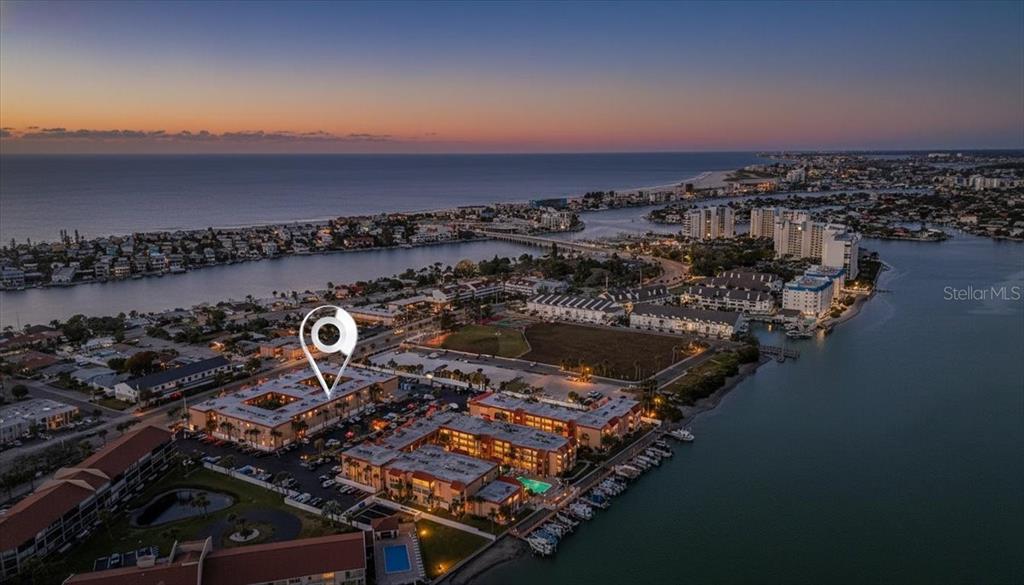 8911 Blind Pass Road, Unit 118 St. Pete Beach, FL 33706 - Photo 2 of 34 an aerial view of multiple house