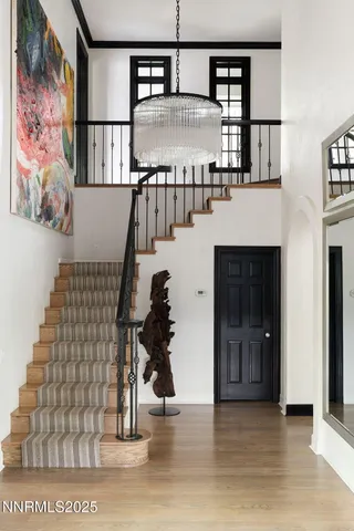 a view of entryway and hall with wooden floor