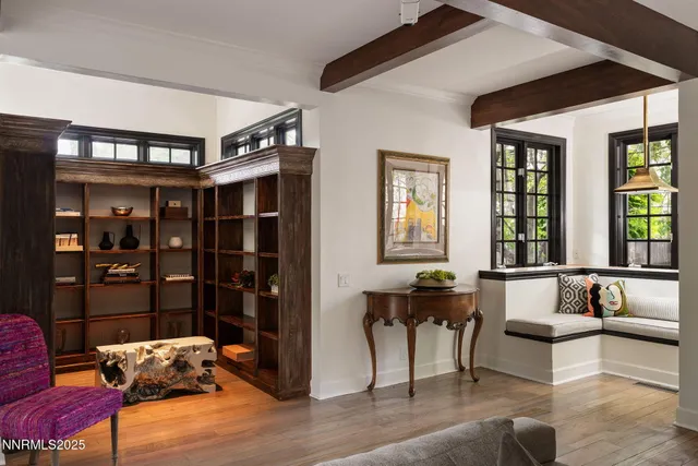 a dining room with furniture and window