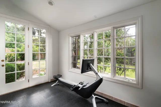a kitchen with stainless steel appliances granite countertop a sink and a refrigerator