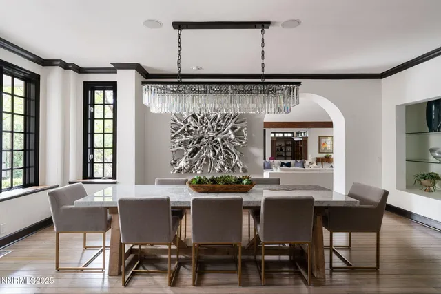a kitchen with stainless steel appliances granite countertop a sink and white cabinets