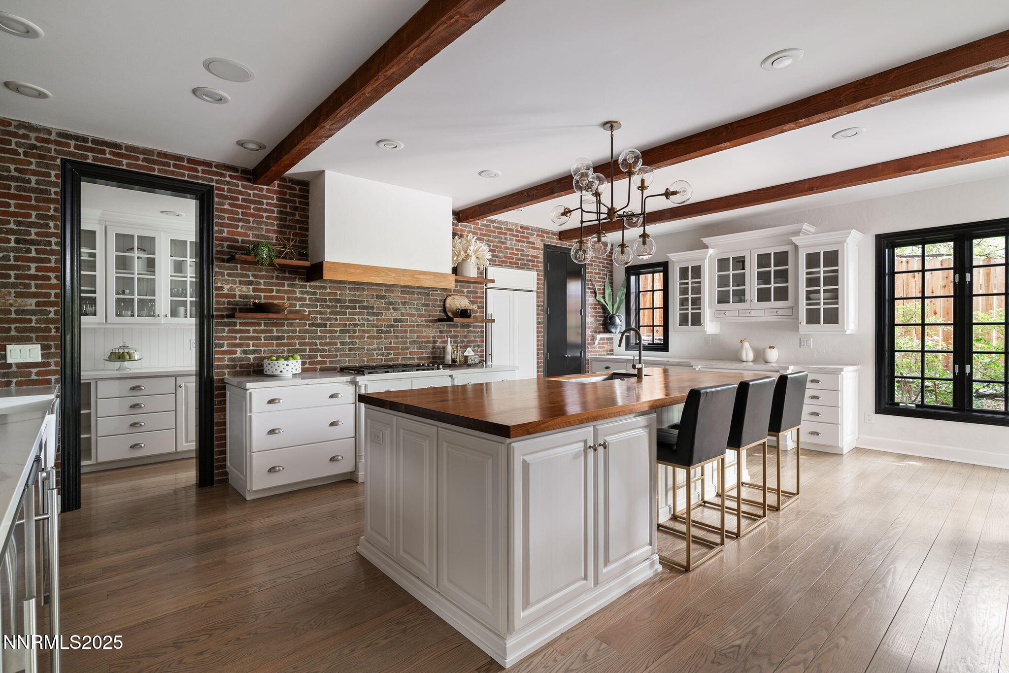 144 Greenridge Drive Reno, NV 89509 - Photo 22 of 71 a kitchen with granite countertop a stove and cabinets