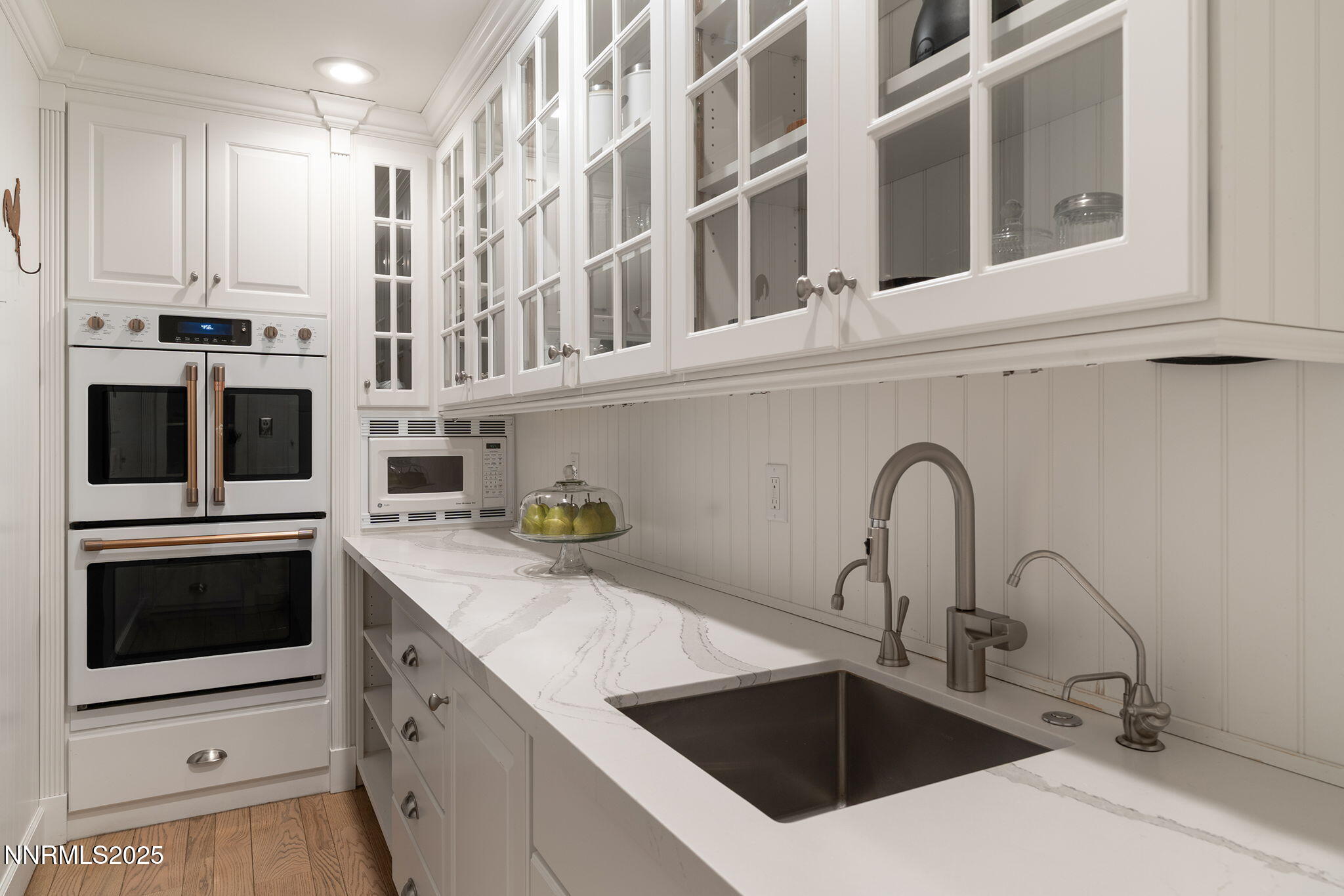144 Greenridge Drive Reno, NV 89509 - Photo 27 of 71 a kitchen with stainless steel appliances granite countertop a sink and white cabinets