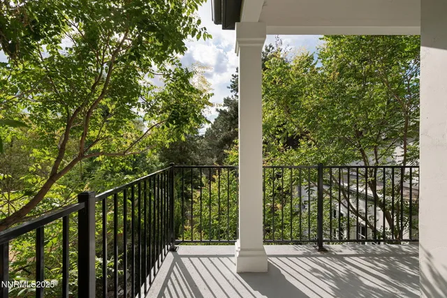 a living room with furniture and a painting on the wall