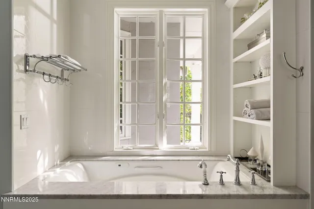 a spacious bedroom with a bed and a couch