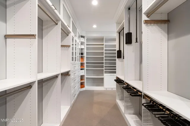 a bathroom with a granite countertop toilet sink and mirror