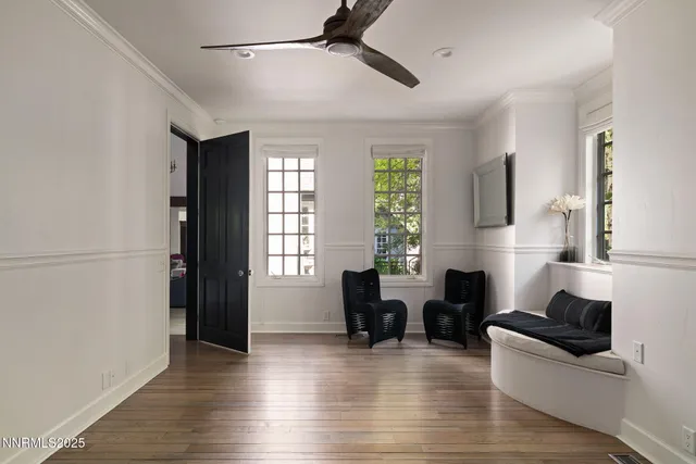 a living room with furniture and windows