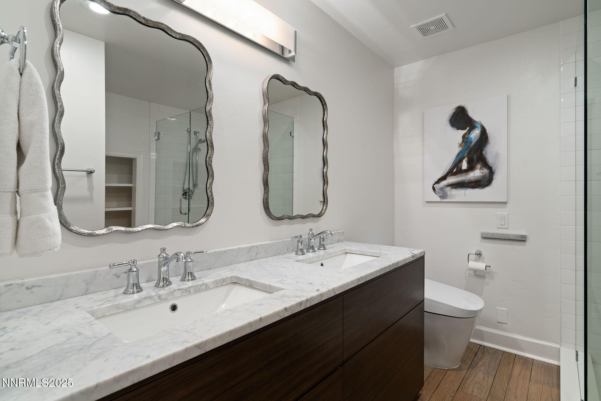 144 Greenridge Drive Reno, NV 89509 - Photo 39 of 71 a bathroom with a double vanity sink and a mirror