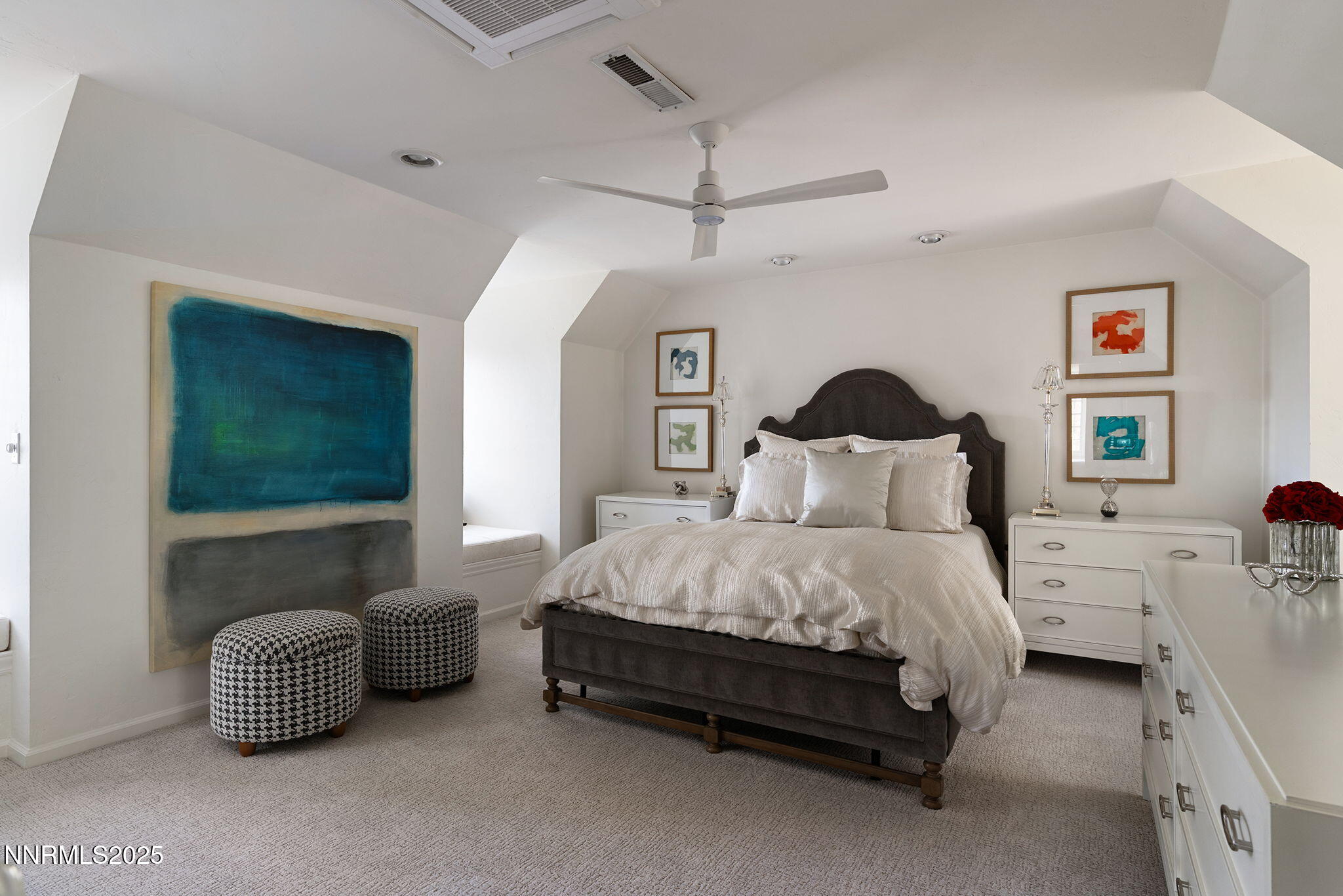 144 Greenridge Drive Reno, NV 89509 - Photo 45 of 71 a spacious bedroom with a bed and a couch