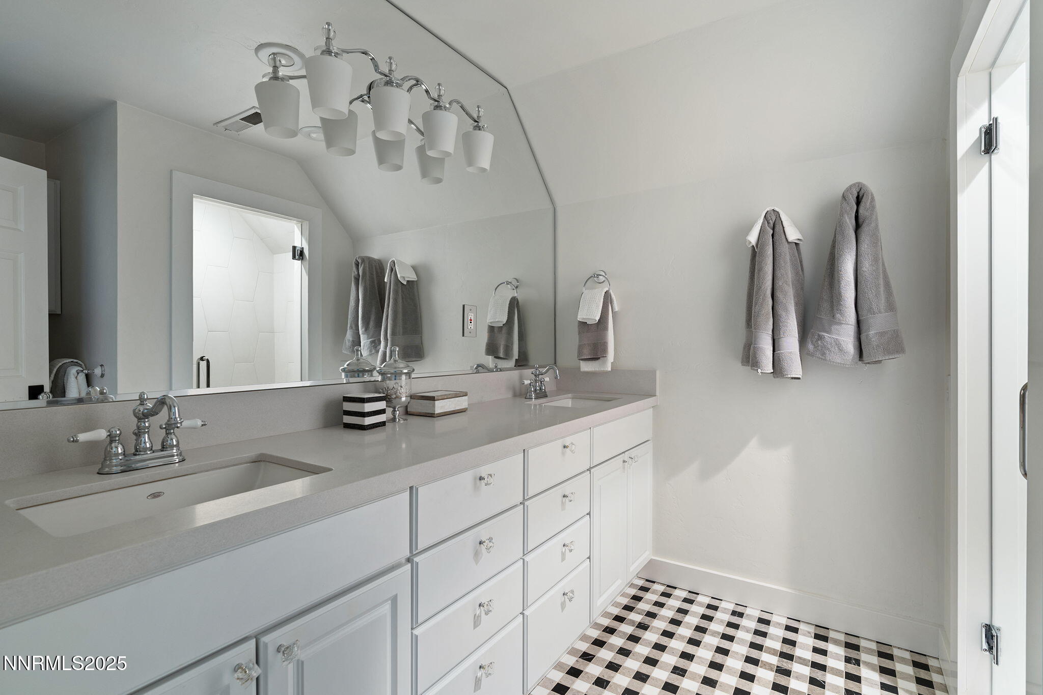 144 Greenridge Drive Reno, NV 89509 - Photo 46 of 71 a bathroom with a double vanity sink and a mirror