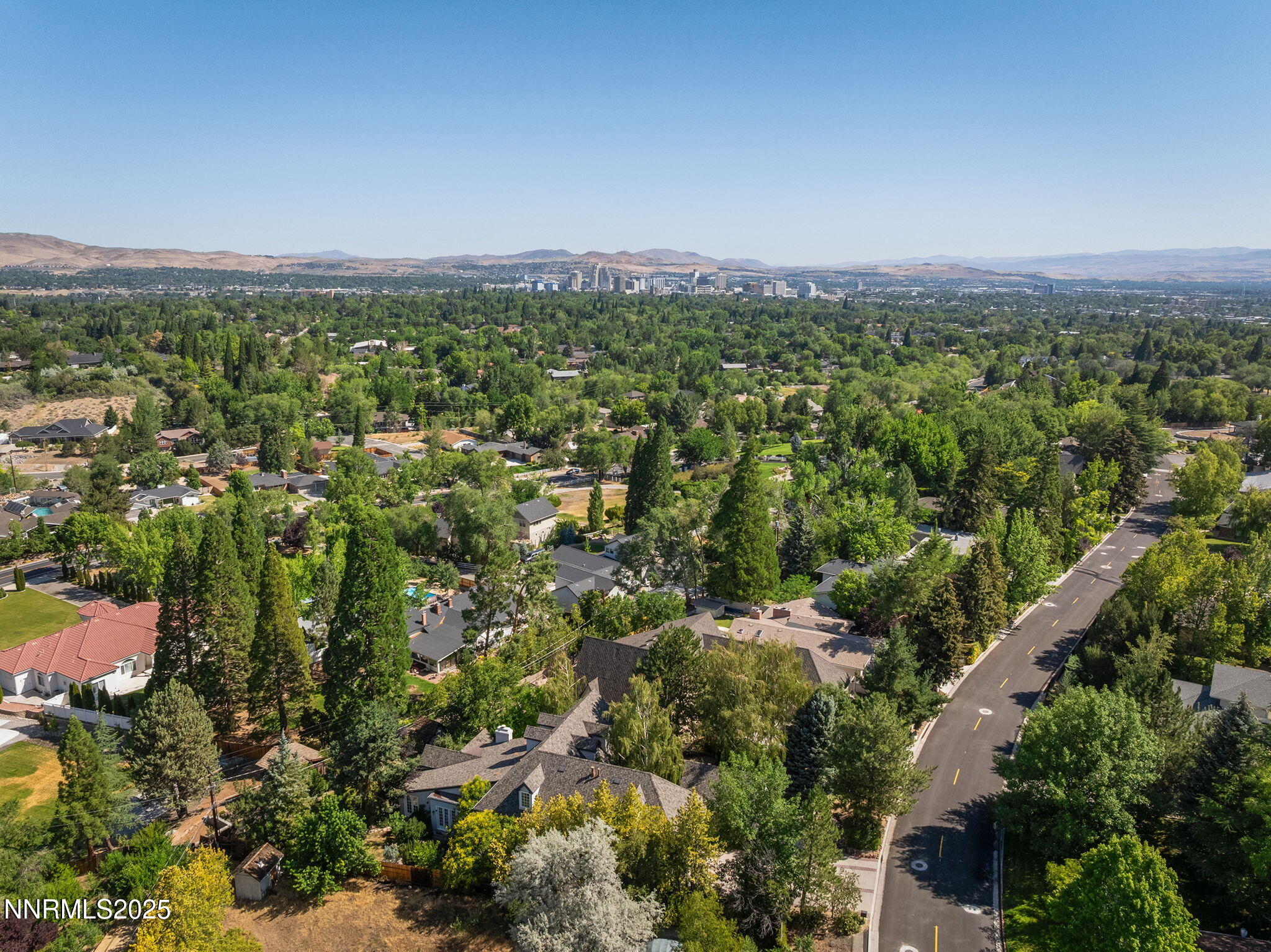 144 Greenridge Drive Reno, NV 89509 - Photo 63 of 71 an aerial view of residential houses with outdoor space and trees