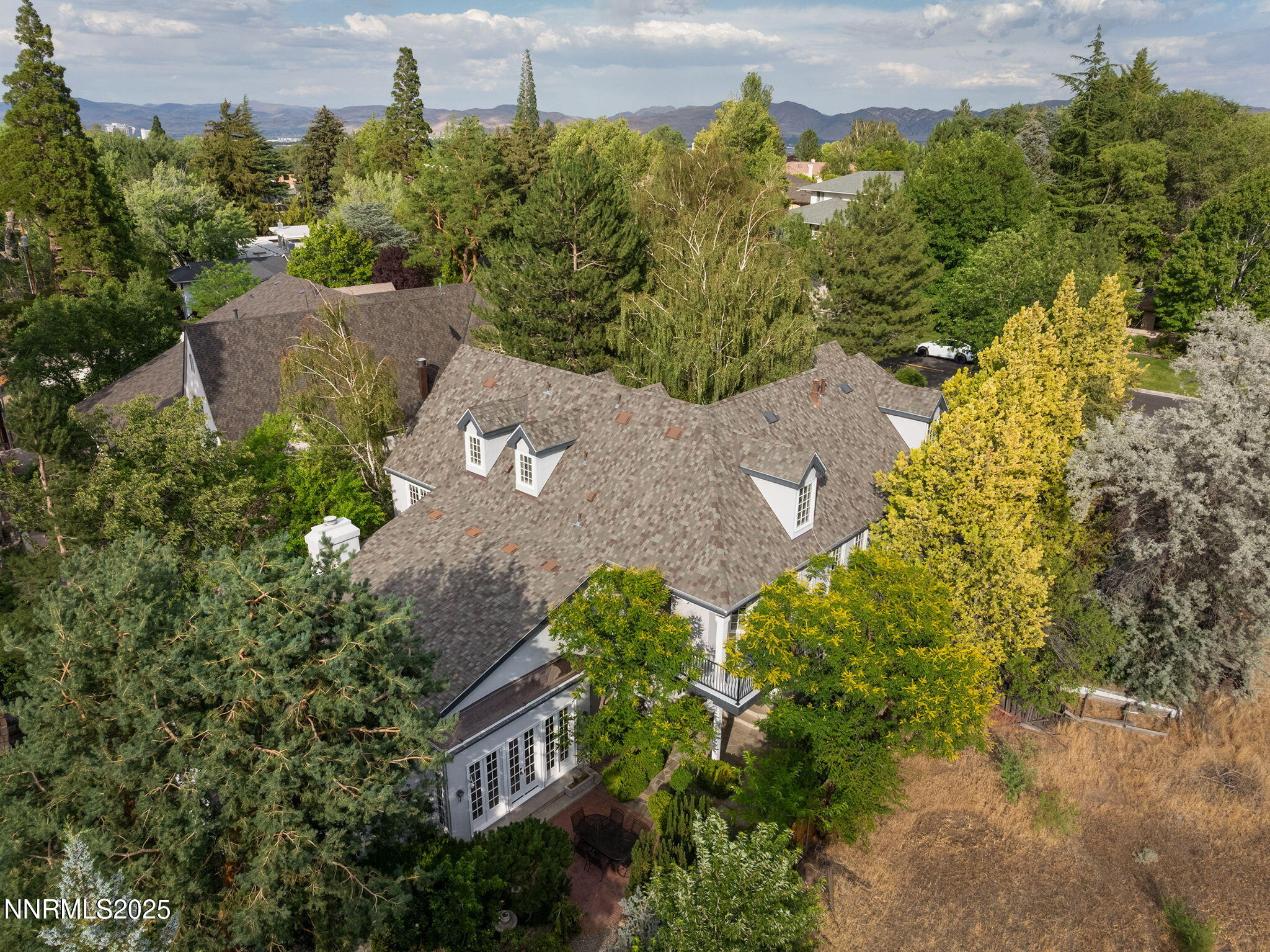 144 Greenridge Drive Reno, NV 89509 - Photo 65 of 71 an aerial view of a house with a yard and lake view