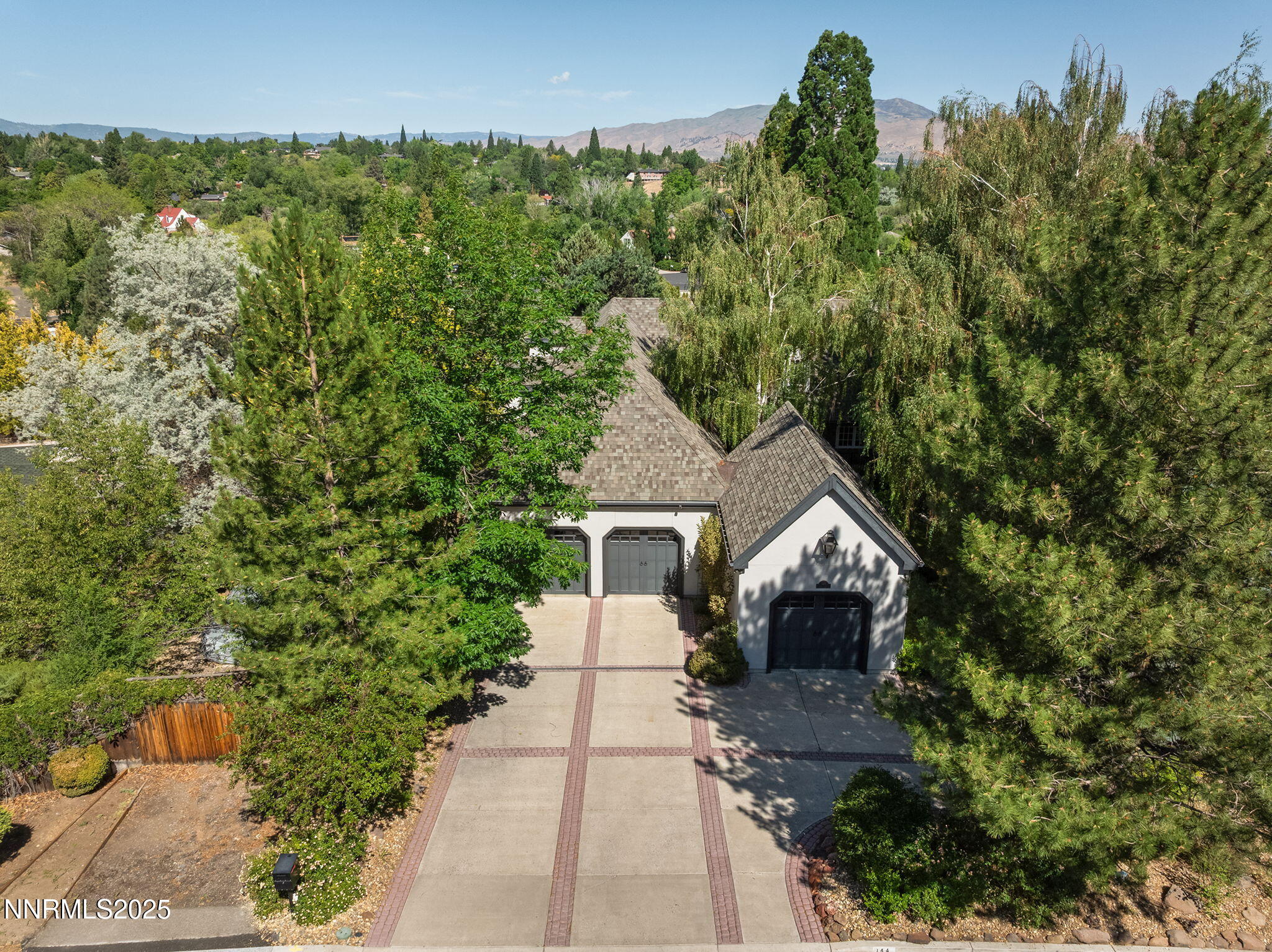 144 Greenridge Drive Reno, NV 89509 - Photo 71 of 71 a front view of a house with a yard and garage