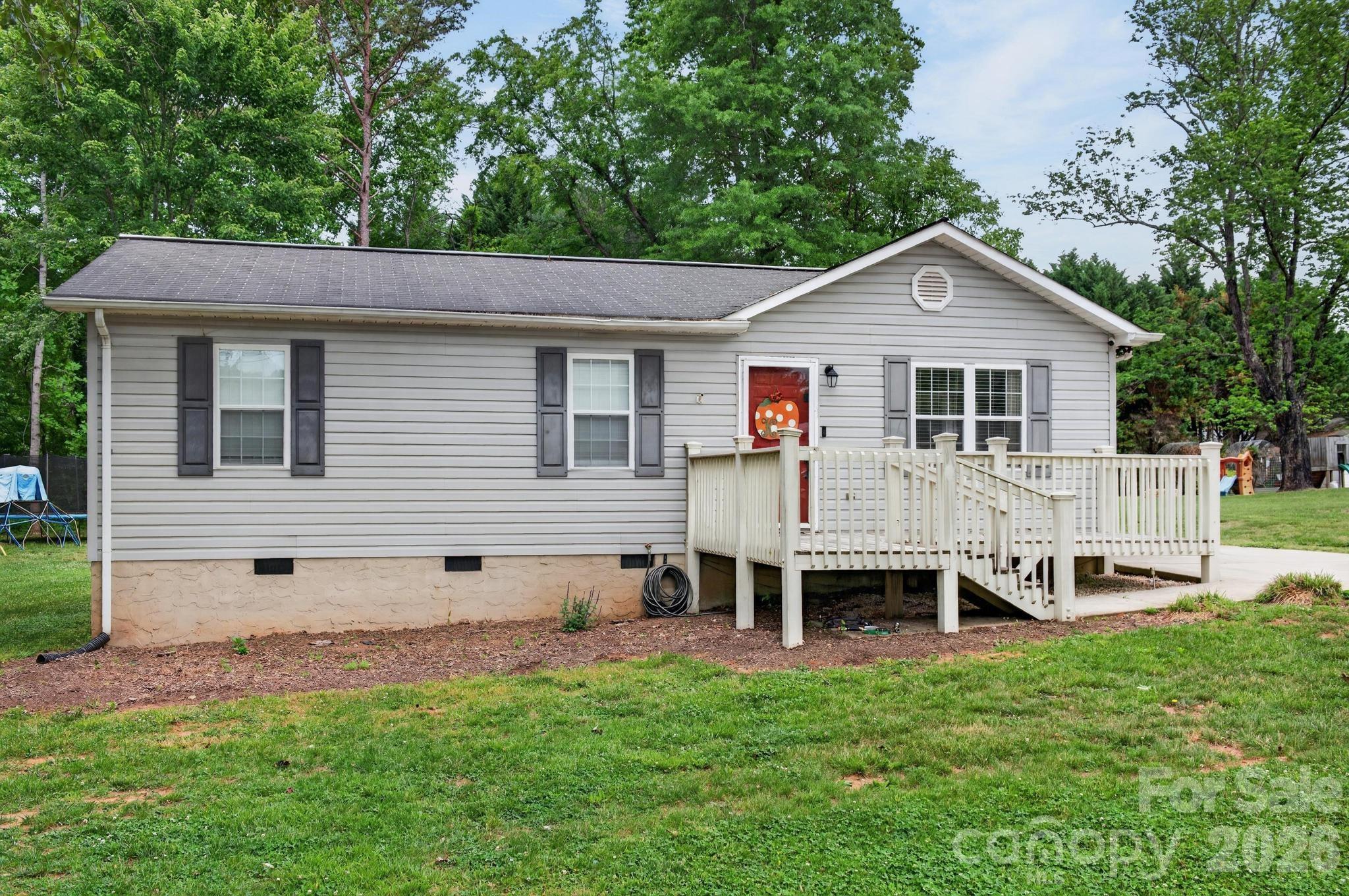 2308 Walt Arney Road Lenoir, NC 28645 - Photo 2 of 37 a view of a house with a backyard