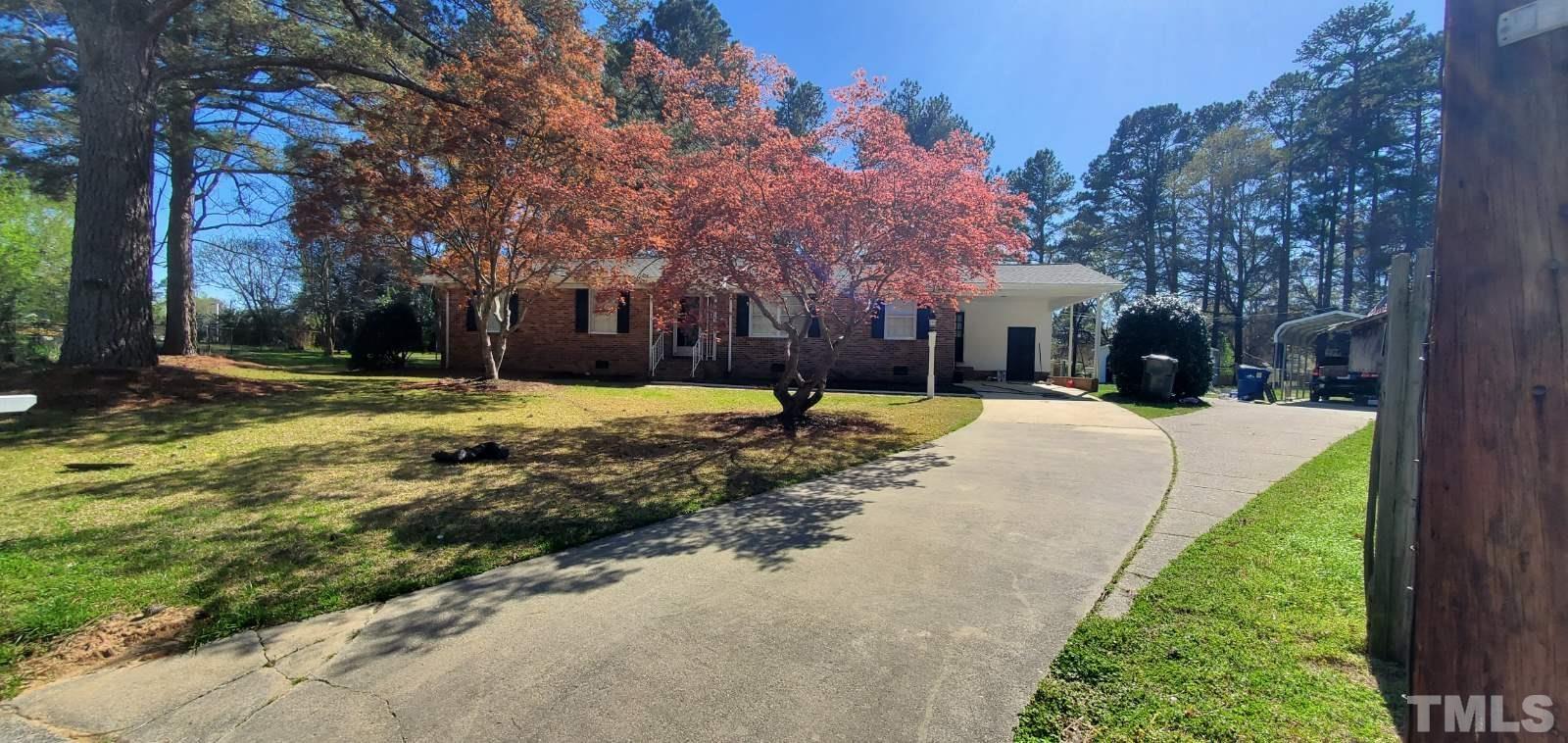 3400 Sheryl Drive Raleigh, NC 27604 - Photo 3 of 39 a view of a house with a yard and large tree