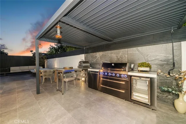 a view of a chairs and table in a patio